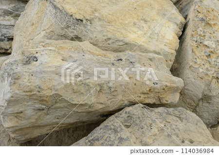 stones strengthening the sea shore in the port texture background 114036984