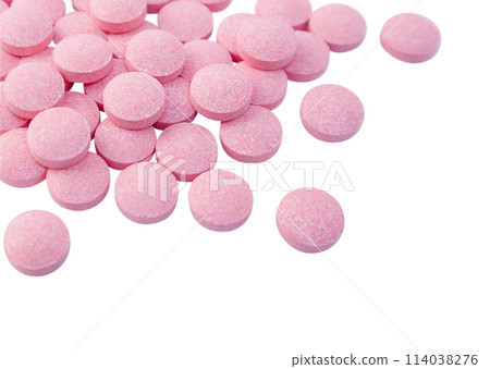 Heap of pink tablets isolated on a white background. Close up. Stock photo. Heap of pink tablets isolated on a white background. Close up. Stock photo. 114038276