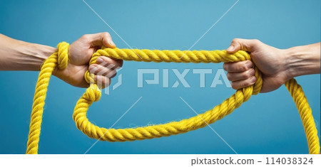 Hands holding on to a rope or cord and pulling in different directions - ai generated image 114038324