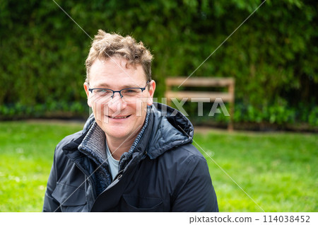 Outdoor portrait of a 45 yo white man with a natural blurred background, Brussels, Belgium 114038452