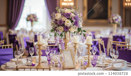 Wedding table decoration with lavender flowers, sweets, cake and candles 114038728