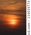 Sunset and silhouette of an airplane 114039774