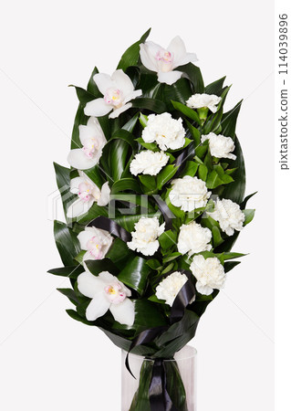 Bouquet of beautiful white flowers with a black ribbon. 114039896