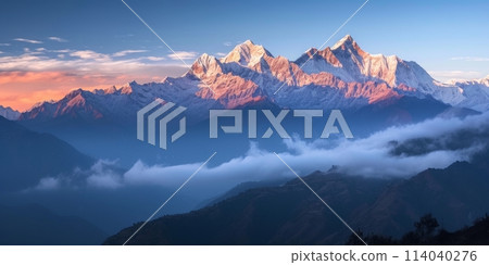 Experience the captivating beauty of nature as the first light adorns the mountain peaks 114040276