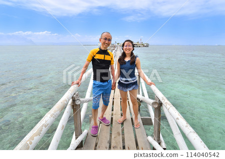 Parents and children enjoying island hopping (Nalusuan Island, Cebu, Philippines) Parents and children enjoying island hopping (Nalusuan Island, Cebu, Philippines) 114040542