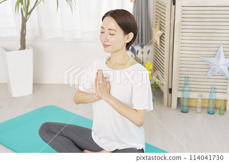 Woman doing yoga at home, meditation pose 114041730