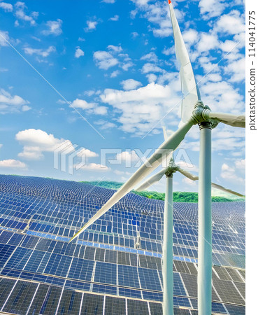 Windmills and solar panels against the blue sky 114041775
