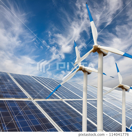 Windmills and solar panels against the blue sky 114041776