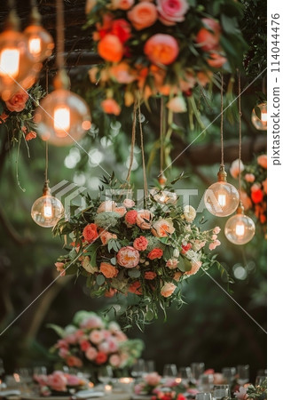 A table with a centerpiece of flowers and a few other decorations 114044476