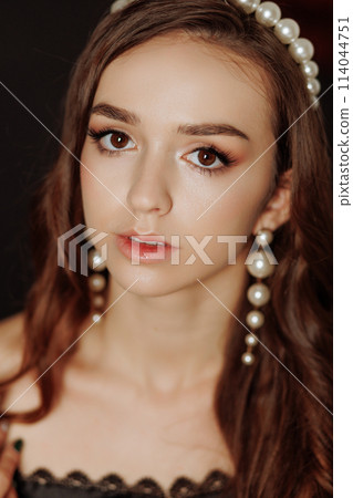 A woman with long brown hair 114044751