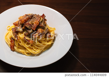 Carbonara pasta with bacon and pepper, top view 114044809