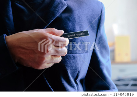 businessman holding a startup business label in his hand businessman holding a startup business label in his hand 114045919