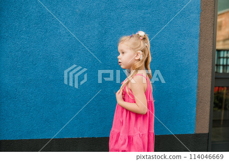 Child girl with hearing aids and cochlear implants having fun outdoor speak and playing. Inclusion and disability. Child girl with hearing aids and cochlear implants having fun outdoor speak and playing. Inclusion and disability. 114046669
