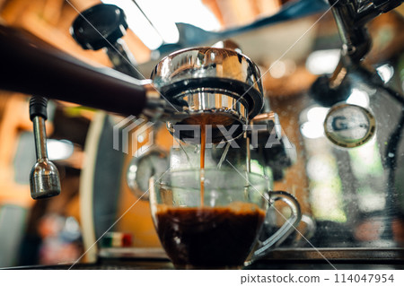 Expresso Coffee machine making a coffee 114047954