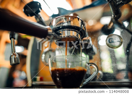 Expresso Coffee machine making a coffee 114048008