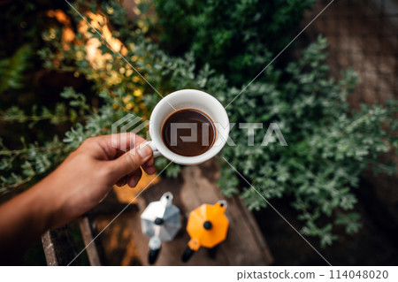 Hot black coffee in a morning cup Hot black coffee in a morning cup 114048020
