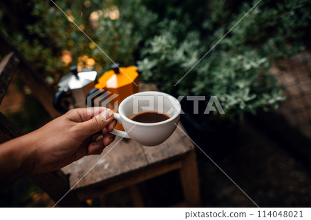 Hot black coffee in a morning cup Hot black coffee in a morning cup 114048021