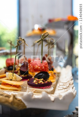 Delectable Skewers On White Platter For Catering Delectable Skewers On White Platter For Catering 114048693
