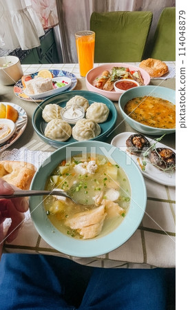Authentic Russian Table Set With Traditional Dishes On A Checkered Tablecloth 114048879