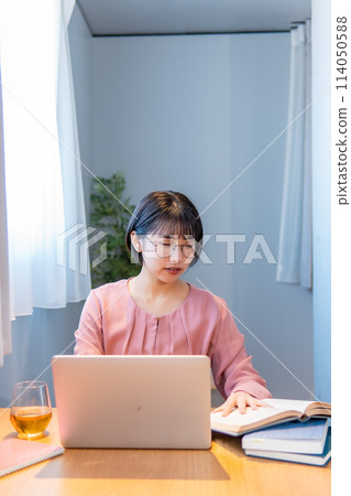 Studying at home/Woman working remotely/Girl with glasses 114050588