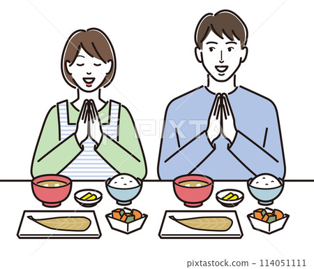 A couple saying "itadakimasu" (thank you for the meal) and eating Japanese food 114051111