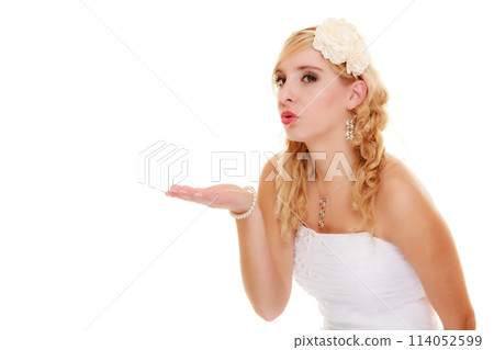 Wedding. Young woman romantic bride blowing a kiss Wedding. Young woman romantic bride blowing a kiss 114052599