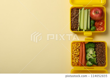 Yellow lunch box with buckwheat and fresh vegetables Yellow lunch box with buckwheat and fresh vegetables 114052835
