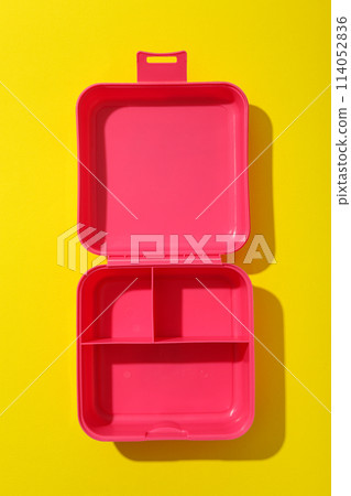 Pink lunch box on a yellow background Pink lunch box on a yellow background 114052836