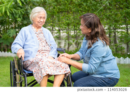 Caregiver help and care Asian senior woman patient sitting on wheelchair at nursing hospital ward, healthy strong medical. 114053026
