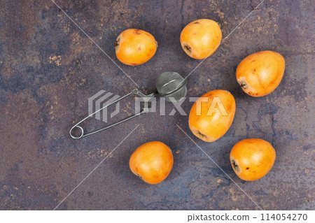Medlar or nispero fruit sauce on a table. 114054270