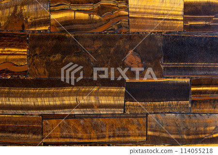 Tigers Eye Golden semi precious stone background, luxury texture material. 114055218