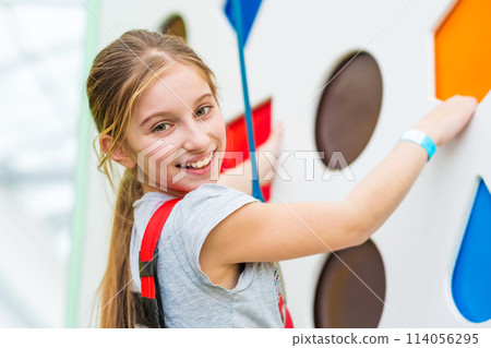 Cute little kid girl in sport equipment climbing Cute little kid girl in sport equipment climbing 114056295