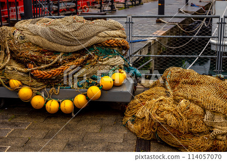 Fishing nets close up in the old port of Genoa, Italy, Liguria. Copy space 114057070