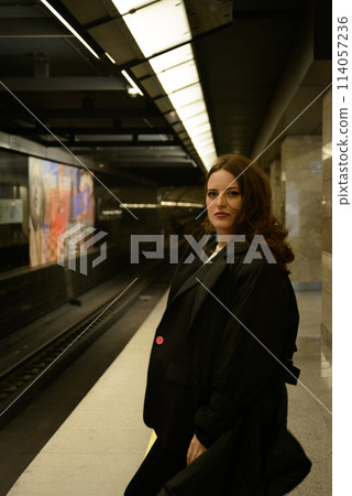 Beautiful lonely girl in black posing in the subway. Beautiful lonely girl in black posing in the subway. 114057236