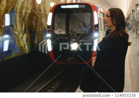 Beautiful lonely girl in black posing in the subway. 114057238