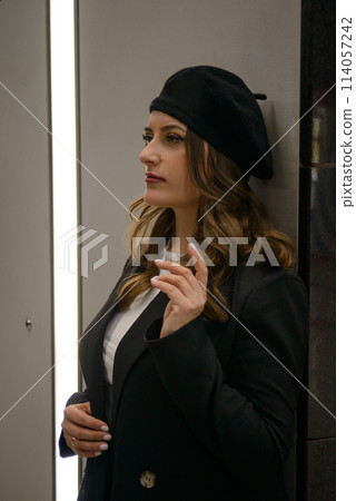 Beautiful lonely girl in black posing in the subway. Beautiful lonely girl in black posing in the subway. 114057242
