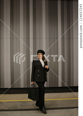 Beautiful lonely girl in black posing in the subway. Beautiful lonely girl in black posing in the subway. 114057245