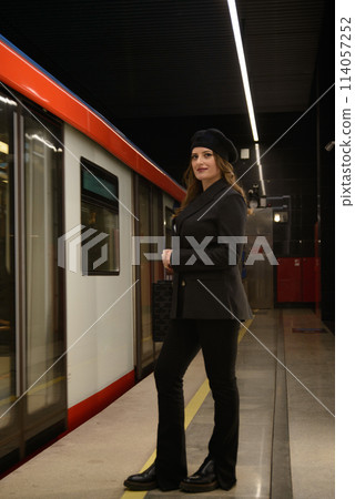 Beautiful lonely girl in black posing in the subway. Beautiful lonely girl in black posing in the subway. 114057252