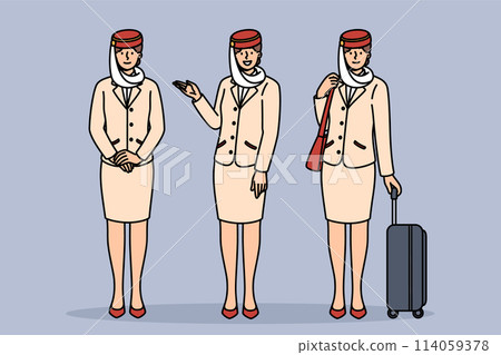Women flight attendants of Arabian airlines, in traditional uniform with national hat and long skirt 114059378
