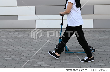 Beautiful and blonde girl practicing long board on the road 114059822