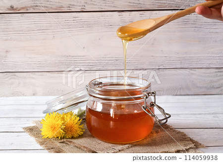 Dandelion jam in a glass jar. The concept of health. Life without cholesterol. Dandelion jam in a glass jar. The concept of health. Life without cholesterol. 114059938