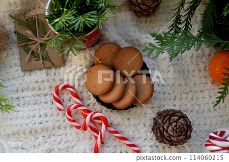Sweet food top view background for merry christmas or new year holiday decoration - chocolate candies, tangerines, cookies, marshmallow and cocoa latte on white wood Sweet food top view background for merry christmas or new year holiday decoration - chocolate candies, tangerines, cookies, marshmallow and cocoa latte on white wood 114060215
