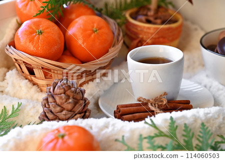 Sweet food top view background for merry christmas or new year holiday decoration - chocolate candies, tangerines, cookies, marshmallow and cocoa latte on white wood 114060503