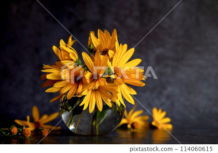 Bouquet of yellow flowers on a dark background in grunge style, abstract floral arrangement, mother's day, wedding gift,spring or autumn background with a place for text, minimalistic holiday concept, 114060615