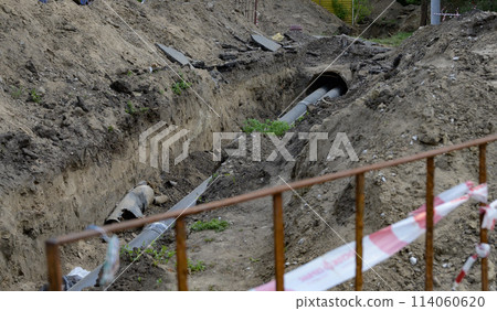 excavator is working and digging at construction site 114060620