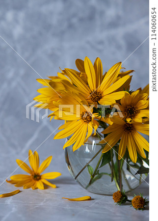 Bouquet of beautiful yellow flowers, eyeglasses and book on windowsill. Mothers day. Wedding. Postcard. 114060654