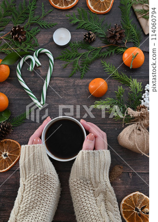 Merry Christmas and Happy Holidays greeting card, frame, banner. New Year. Christmas white handmade gifts and red decor on light background top view. Winter xmas holiday theme. Flat lay 114060794