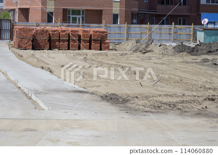 excavator is working and digging at construction site 114060880