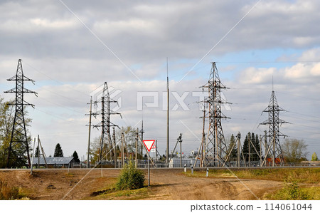 View of power lines near residential buildings. Electricity. View of power lines near residential buildings. Electricity. 114061044