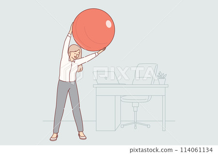 Woman office manager does gymnastics at workplace, uses pilates ball to stretch spine 114061134
